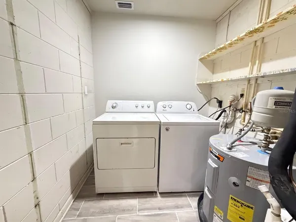 a utility room with dryer and washer