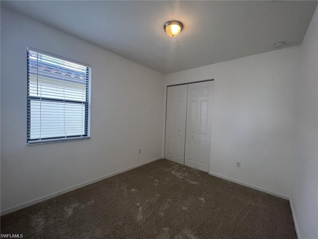 5459 Useppa Drive Ave Maria, FL 34142 - Photo 12 of 27 an empty room with windows