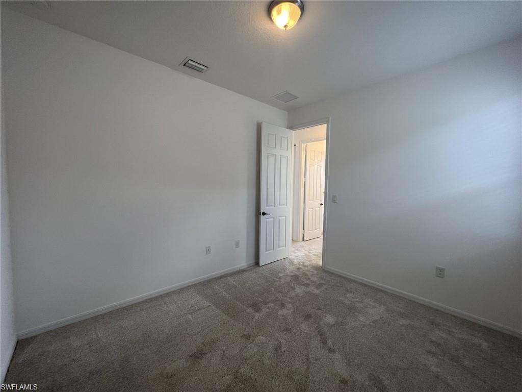 5459 Useppa Drive Ave Maria, FL 34142 - Photo 13 of 27 a view of an empty room and window