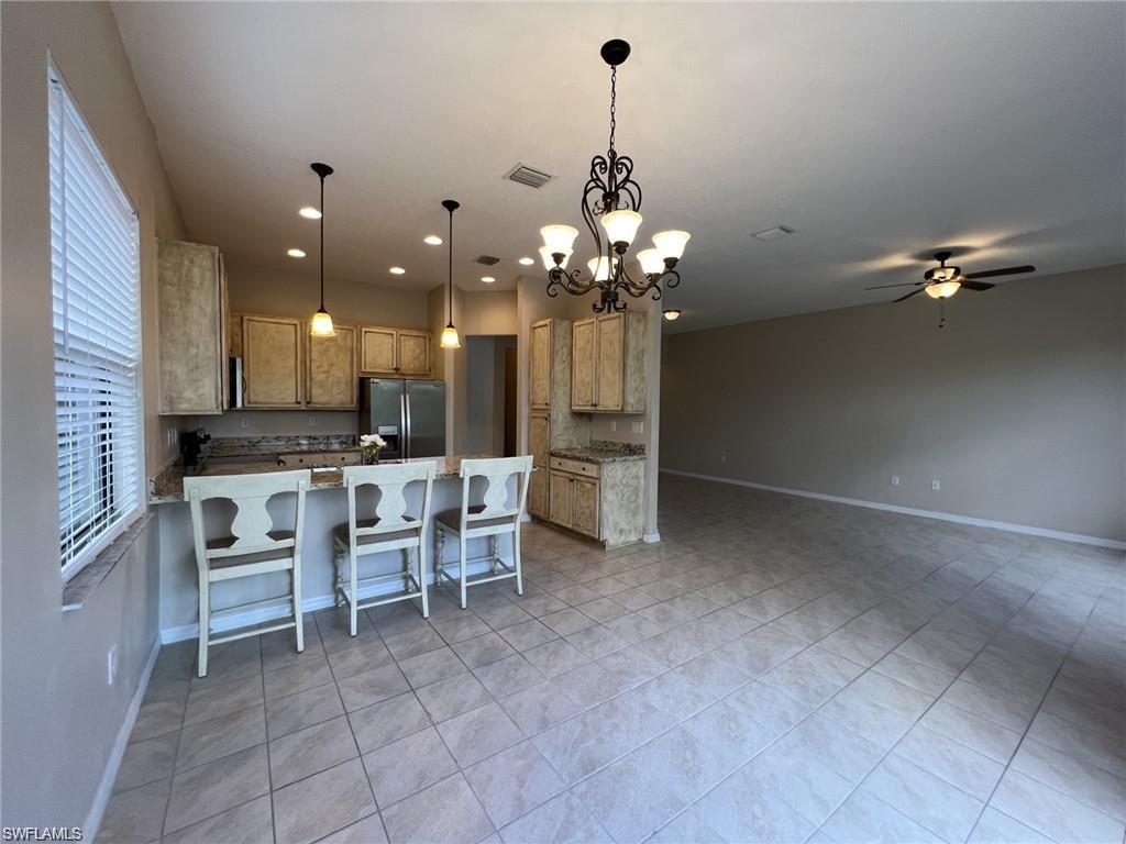 5459 Useppa Drive Ave Maria, FL 34142 - Photo 27 of 27 a view of a dining room kitchen and a window