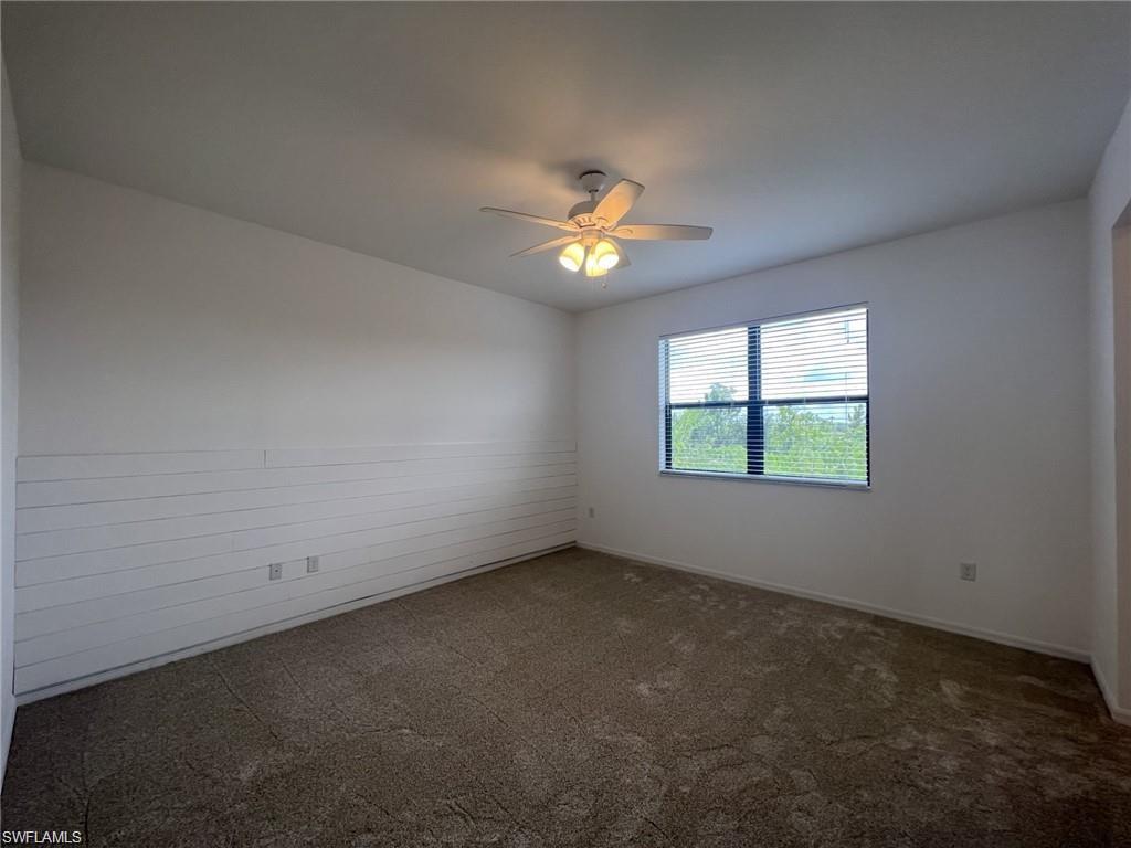 5459 Useppa Drive Ave Maria, FL 34142 - Photo 5 of 27 an empty room with a window and a fan