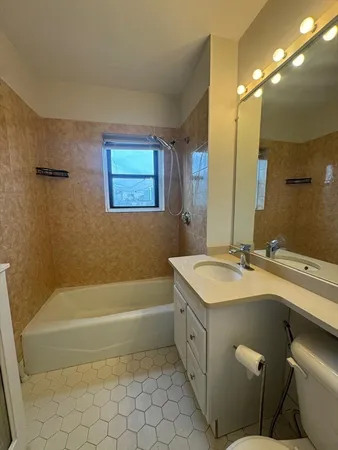 a bathroom with a sink double vanity and a bathtub