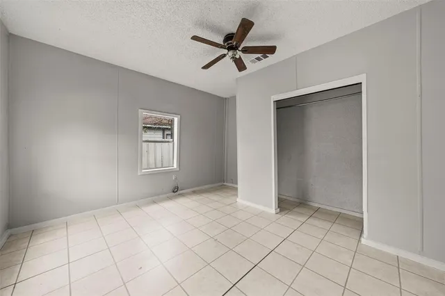 a view of an empty room and a window