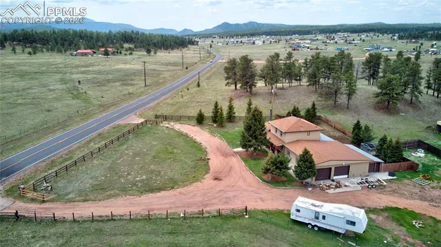 an aerial view of a house with outdoor space
