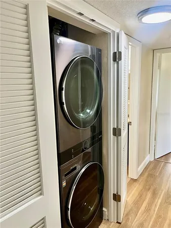 a view of a hallway with washer and dryer