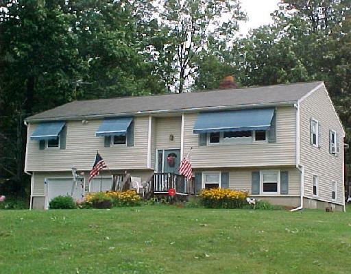 a view of outdoor space yard and front view of house