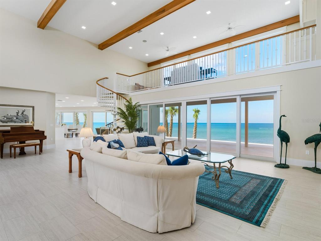 790 North Manasota Key Road Englewood, FL 34223 - Photo 11 of 80 a living room with furniture and a large window