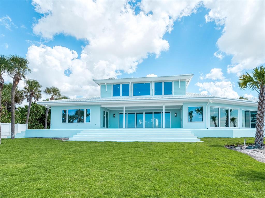 790 North Manasota Key Road Englewood, FL 34223 - Photo 18 of 80 a front view of a house with a yard