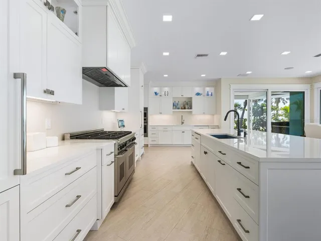 a spacious bedroom with a bed and a window