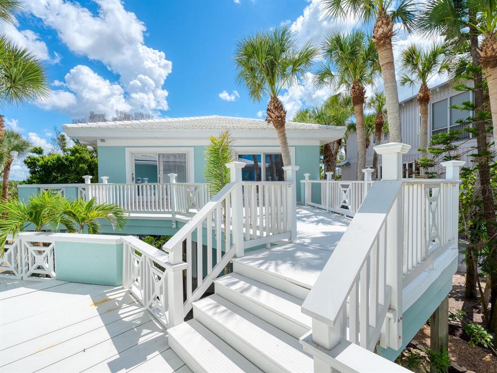 790 North Manasota Key Road Englewood, FL 34223 - Photo 50 of 80 a view of house with swimming pool and furniture