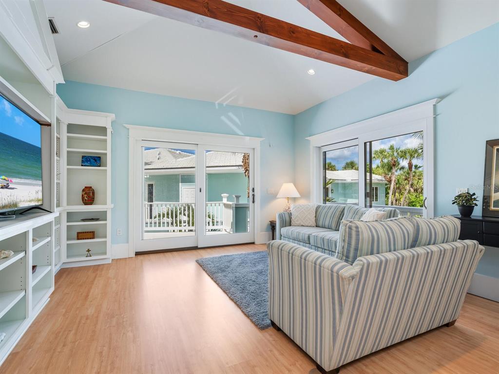 790 North Manasota Key Road Englewood, FL 34223 - Photo 53 of 80 a living room with furniture and a flat screen tv