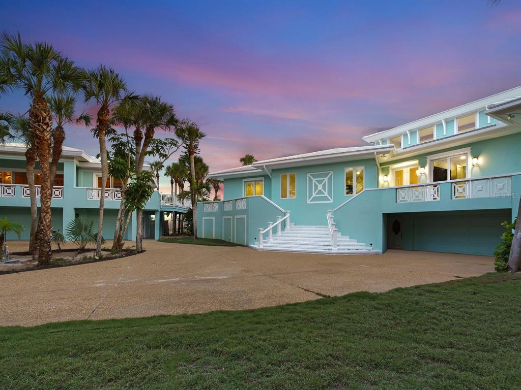 790 North Manasota Key Road Englewood, FL 34223 - Photo 66 of 80 a front view of a house with a garden and yard