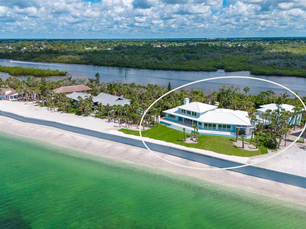 790 North Manasota Key Road Englewood, FL 34223 - Photo 76 of 80 an aerial view of a house with a lake view