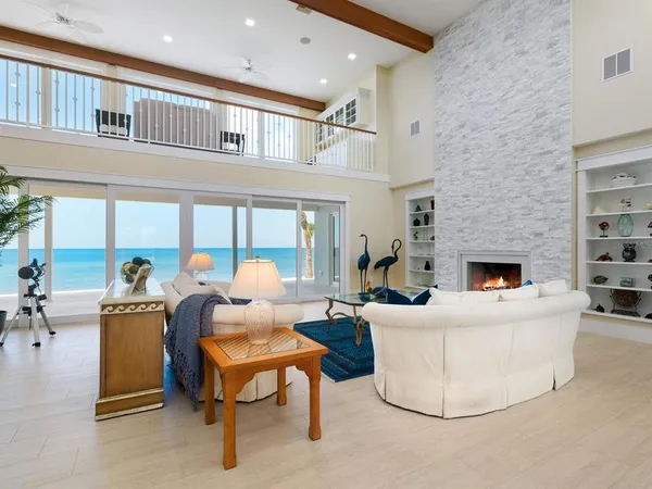 a living room with furniture a coffee table and a fireplace