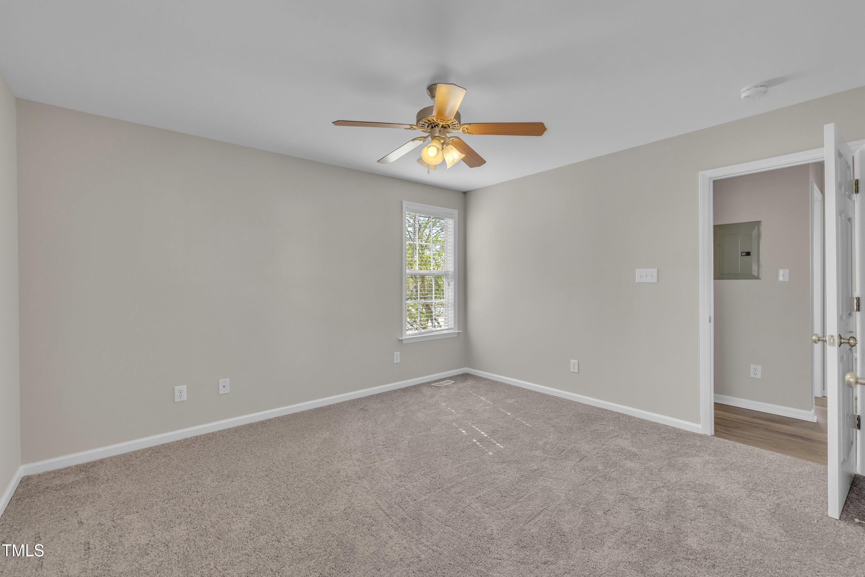 147 Tralee Drive Smithfield, NC 27577 - Photo 14 of 43 a view of an empty room with a window