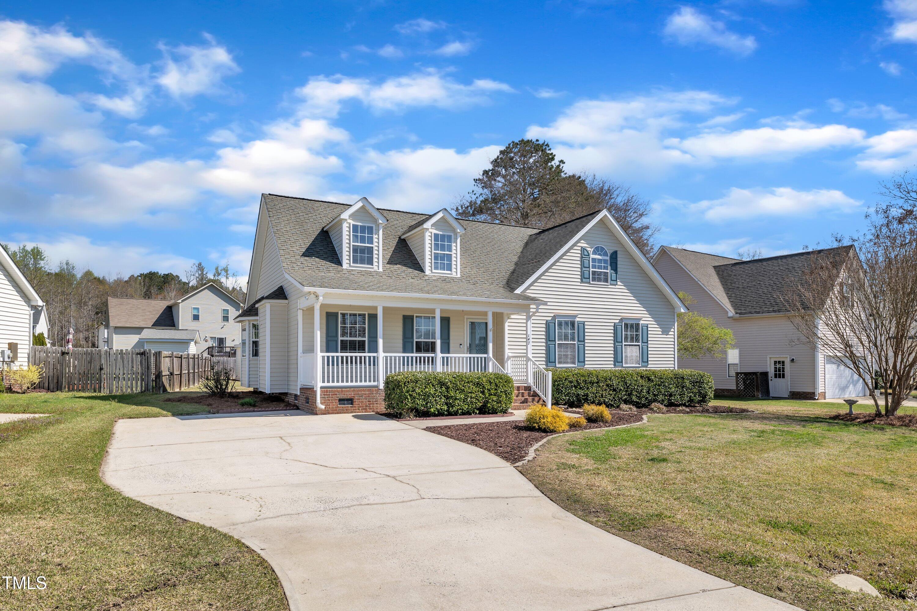 147 Tralee Drive Smithfield, NC 27577 - Photo 2 of 43 a front view of a house with a yard
