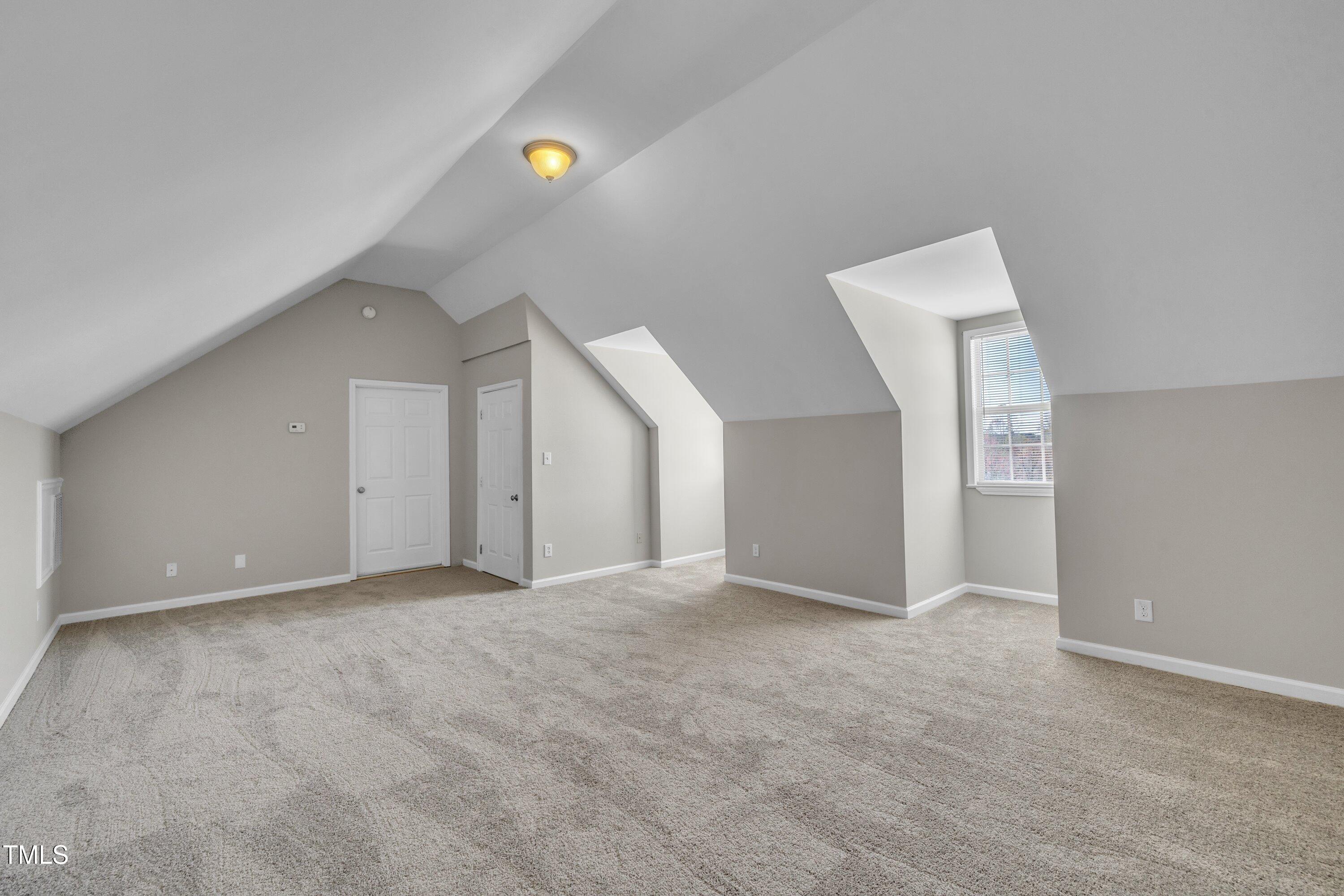 147 Tralee Drive Smithfield, NC 27577 - Photo 22 of 43 a view of an empty room with a window
