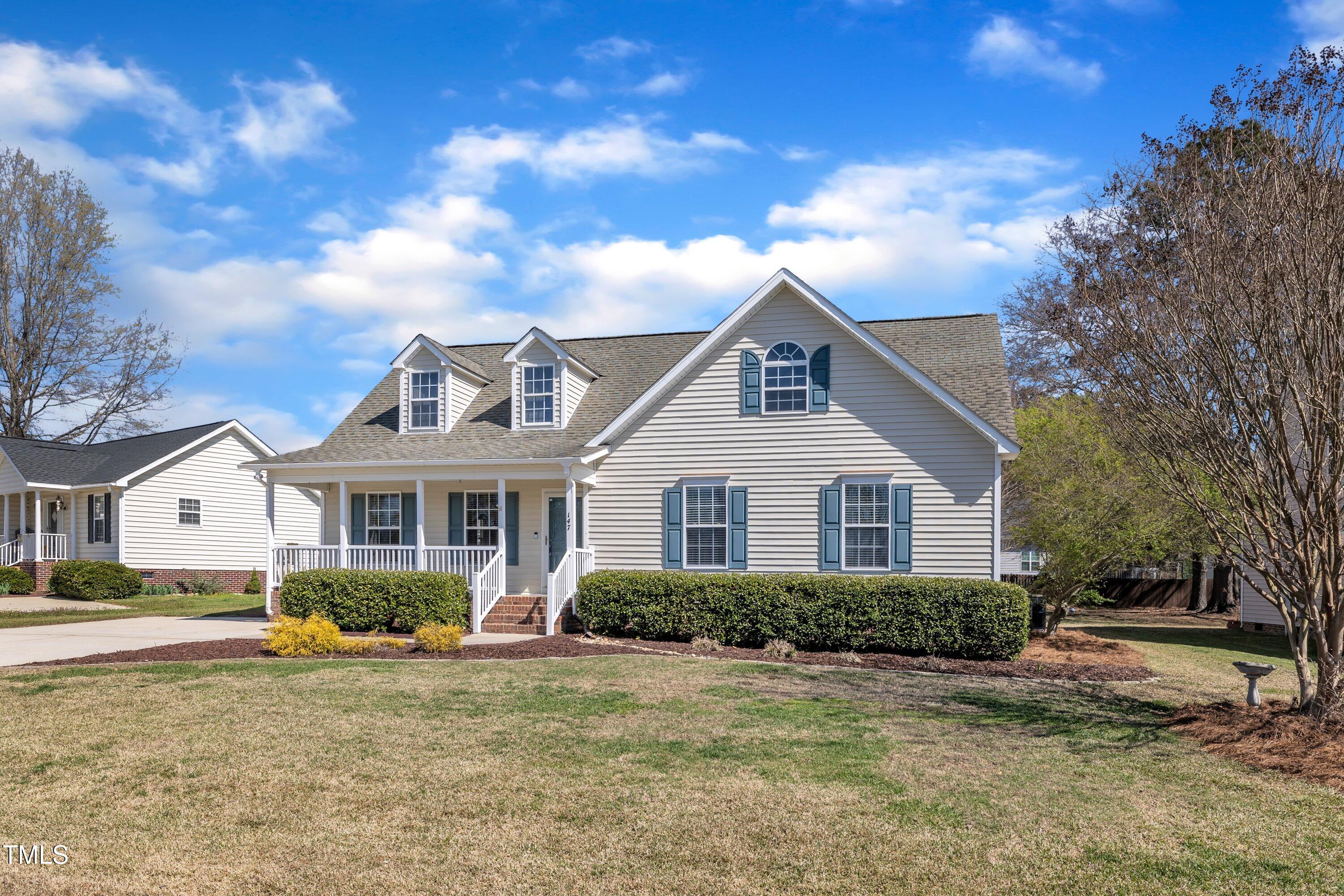 147 Tralee Drive Smithfield, NC 27577 - Photo 3 of 43 a front view of a house with a garden