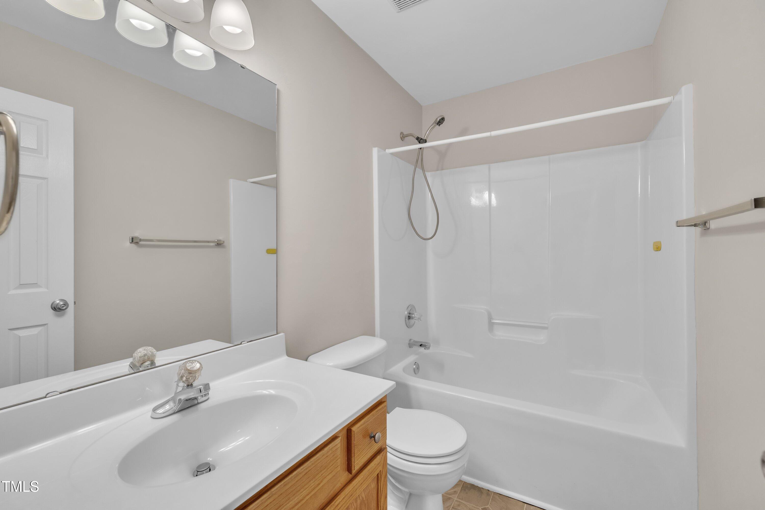 147 Tralee Drive Smithfield, NC 27577 - Photo 10 of 43 a bathroom with a sink toilet and shower