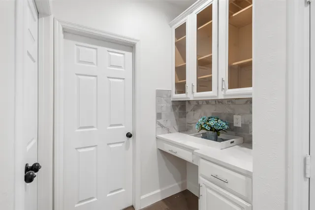 a view of an entryway with wooden floor