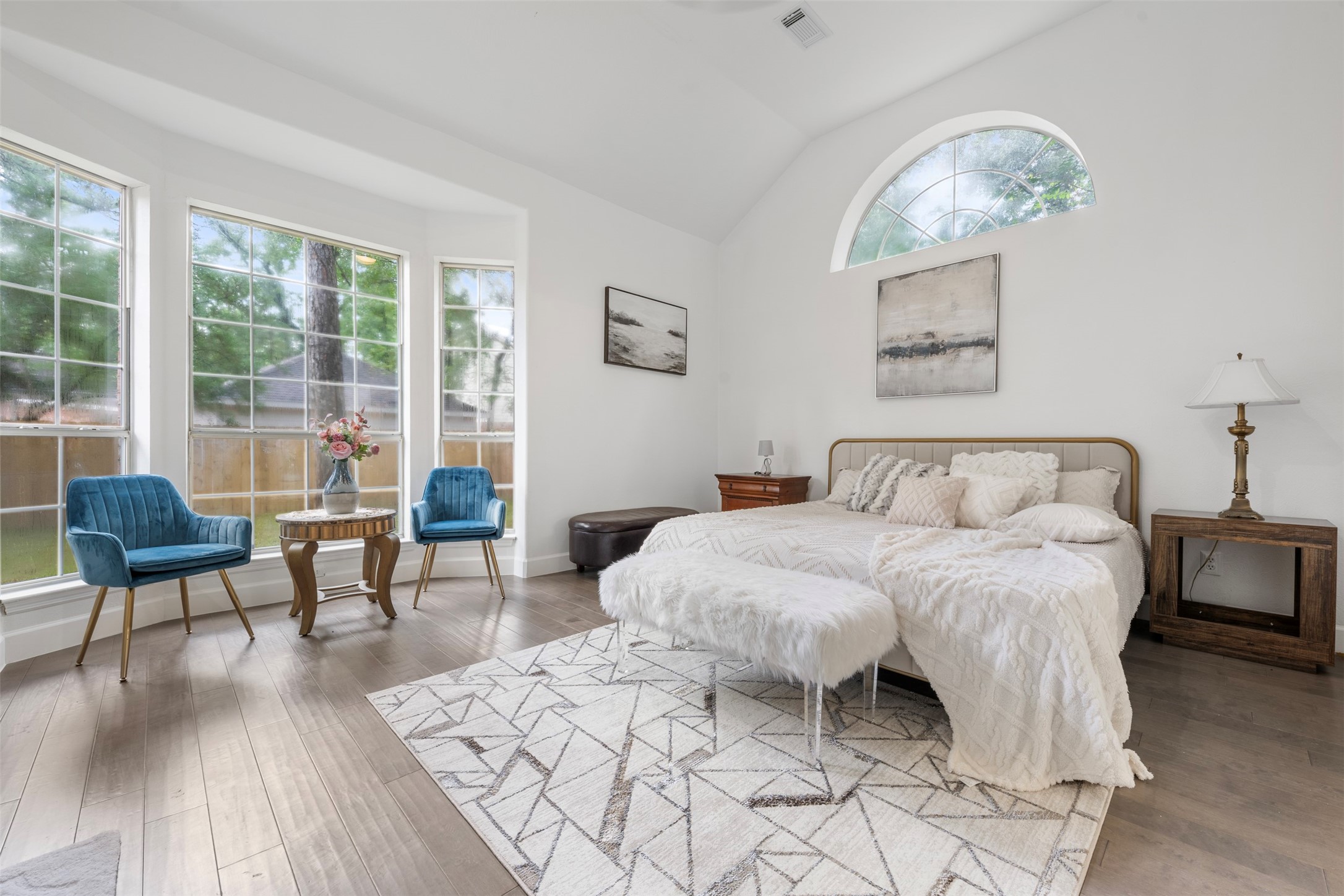 55 Terraglen Drive Spring, TX 77382 - Photo 14 of 32 a spacious bedroom with a bed a table and chair