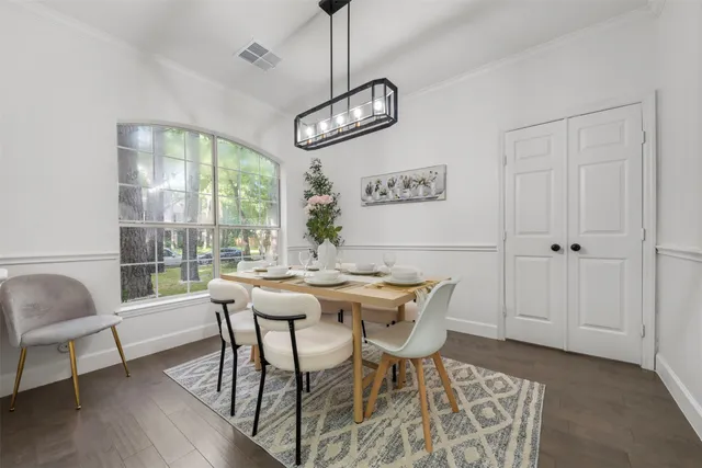 a view of a dining room with furniture window and outside view