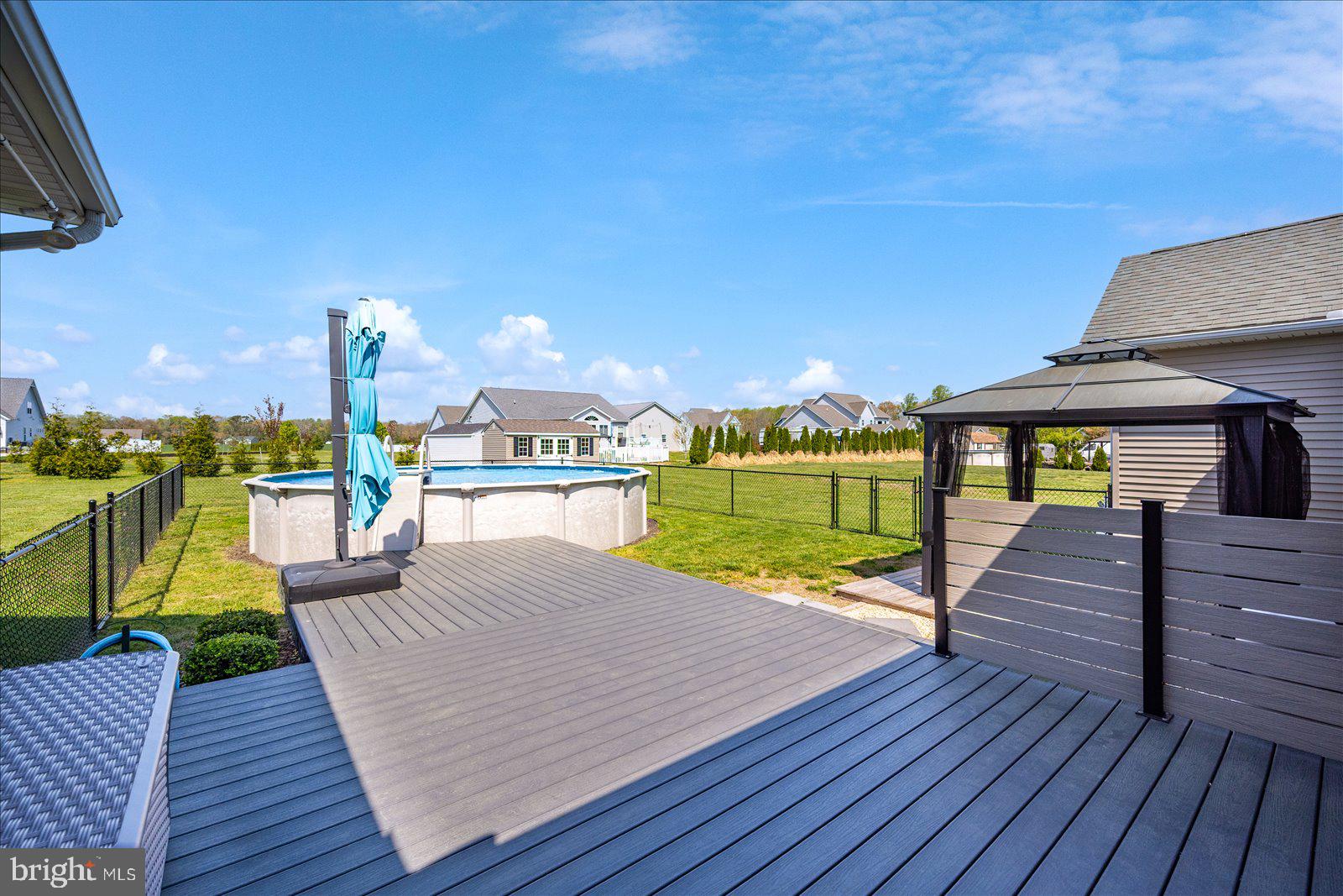 16344 Sand Hill Road Milton, DE 19968 - Photo 21 of 33 Sunny backyard oasis with pool view.