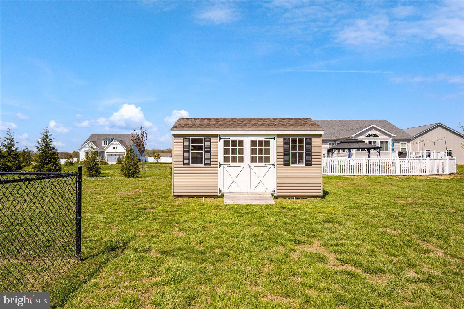 16344 Sand Hill Road Milton, DE 19968 - Photo 26 of 33 Charming shed in a spacious yard.
