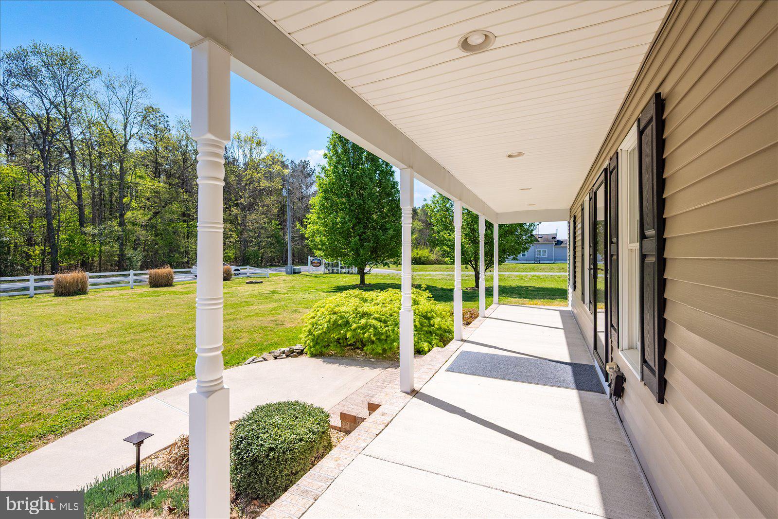 16344 Sand Hill Road Milton, DE 19968 - Photo 8 of 33 Charming porch with serene views.