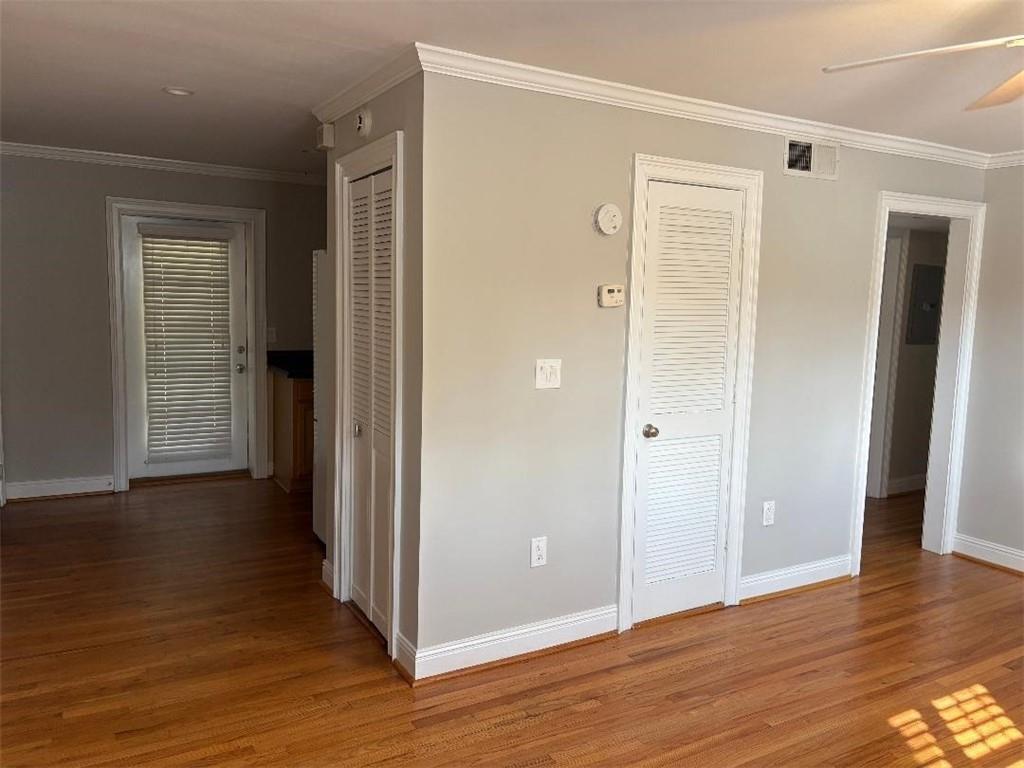 1647 Briarcliff Road Northeast, Unit 1 Atlanta, GA 30306 - Photo 2 of 11 an empty room with wooden floor & windows