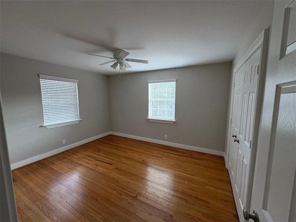 1647 Briarcliff Road Northeast, Unit 1 Atlanta, GA 30306 - Photo 4 of 11 a view of an empty room with wooden floor and a window
