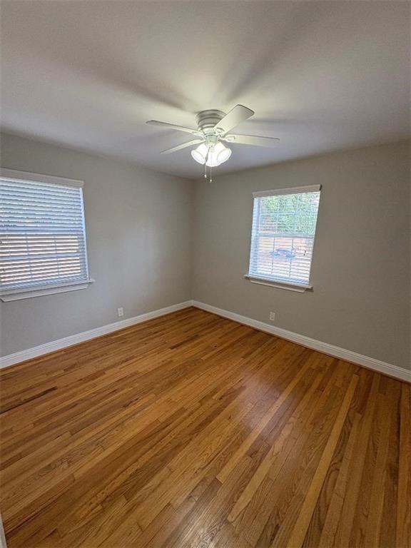 1647 Briarcliff Road Northeast, Unit 1 Atlanta, GA 30306 - Photo 5 of 11 a view of empty room with wooden floor and fan