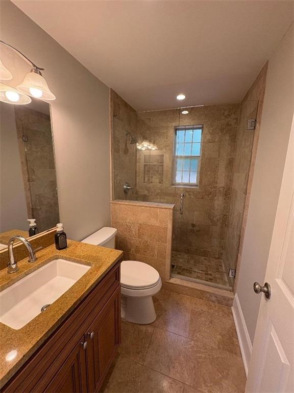 1647 Briarcliff Road Northeast, Unit 1 Atlanta, GA 30306 - Photo 7 of 11 a bathroom with a sink toilet and shower