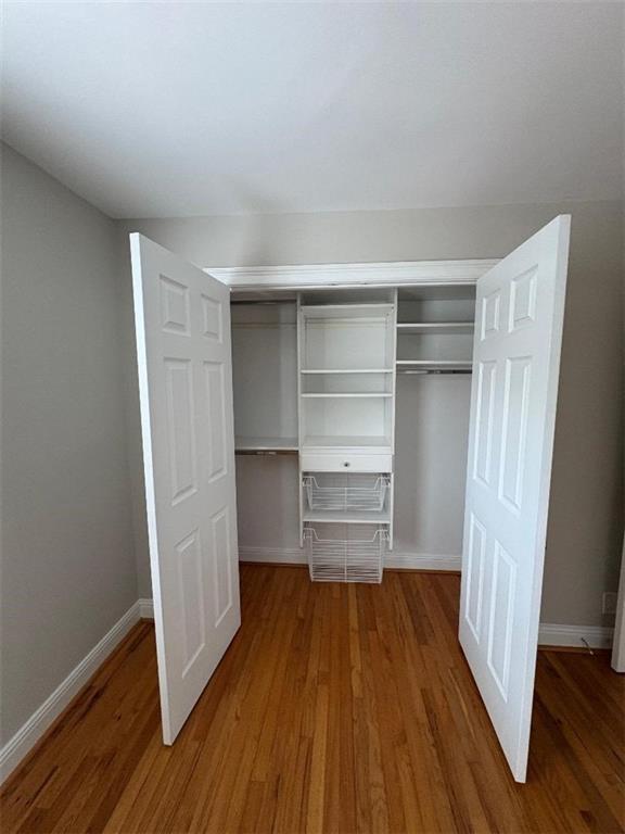 1647 Briarcliff Road Northeast, Unit 1 Atlanta, GA 30306 - Photo 10 of 11 a room with walk in closet and wooden floor
