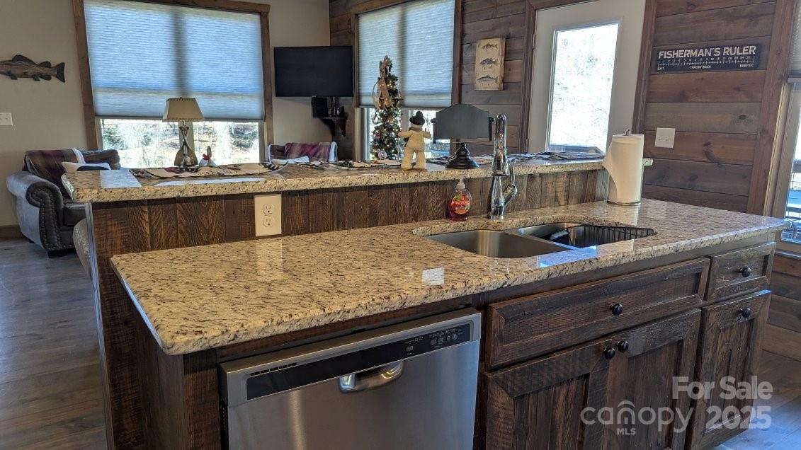 19 Santa Rosa Drive, Unit 6 Sylva, NC 28779 - Photo 5 of 10 a kitchen with granite countertop a sink and a wooden floor