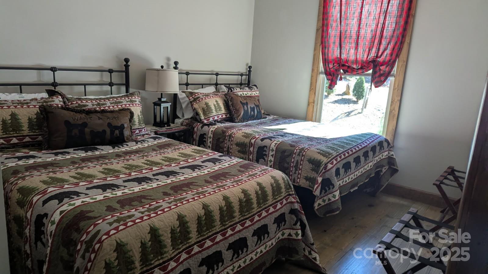 19 Santa Rosa Drive, Unit 6 Sylva, NC 28779 - Photo 8 of 10 a bedroom with two beds and a chandelier