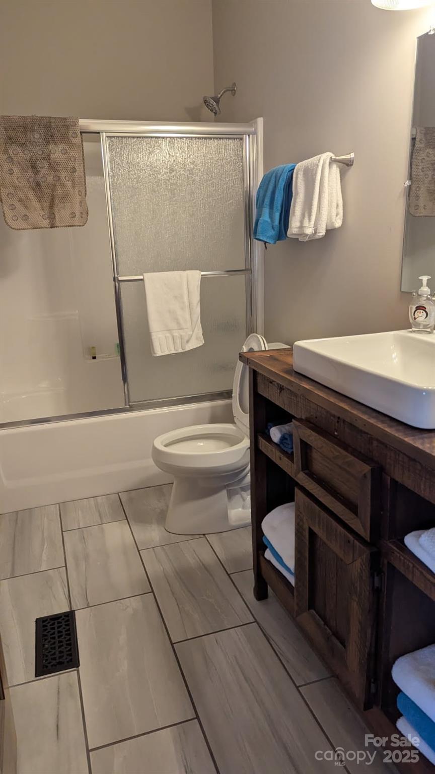 19 Santa Rosa Drive, Unit 6 Sylva, NC 28779 - Photo 9 of 10 a bathroom with a sink a toilet and vanity