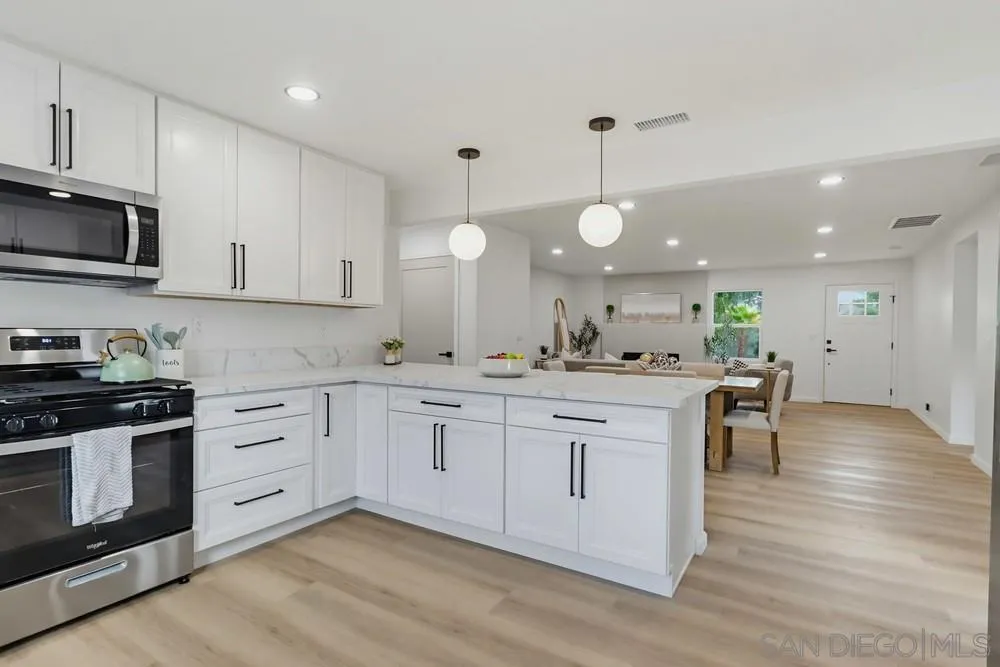 15751 Lyons Valley Road Jamul, CA 91935 - Photo 12 of 59 a kitchen with a white cabinets and stove top oven
