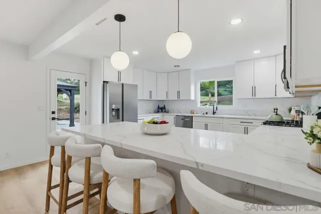 a living room with furniture a window and a fireplace