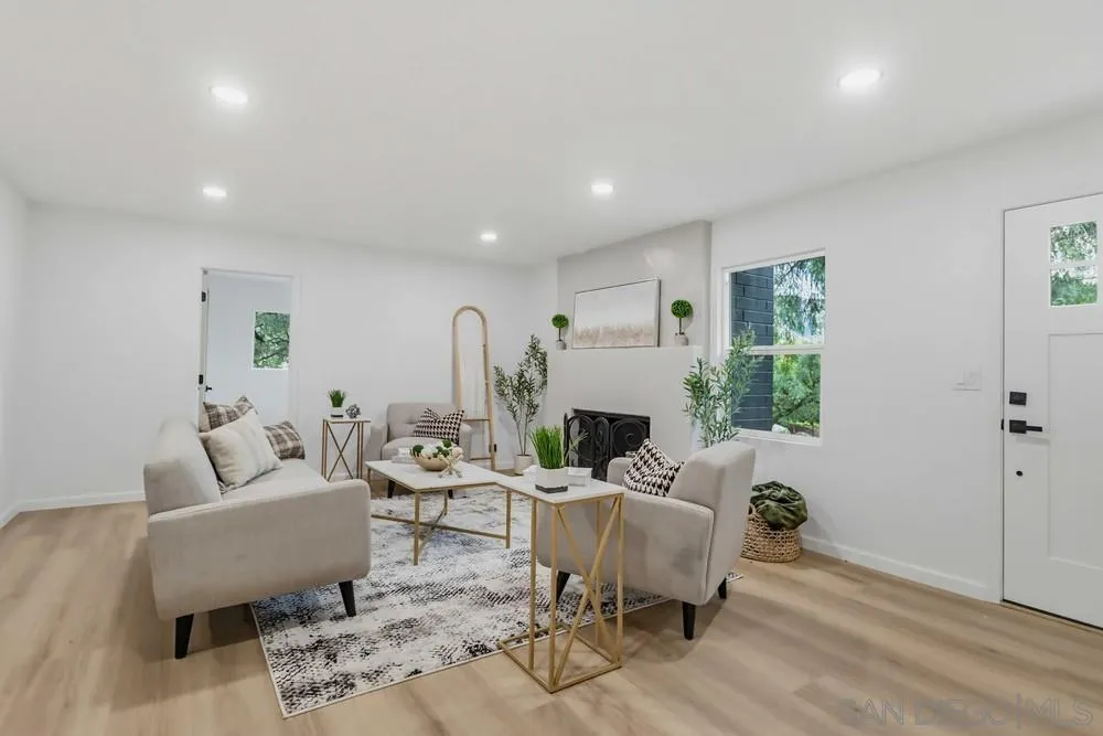 15751 Lyons Valley Road Jamul, CA 91935 - Photo 15 of 59 a living room with furniture a window and a fireplace