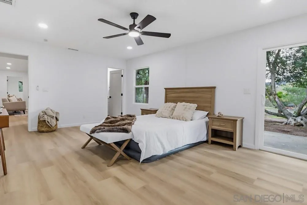 15751 Lyons Valley Road Jamul, CA 91935 - Photo 20 of 59 a bedroom with a bed and a chair