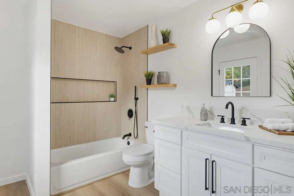 15751 Lyons Valley Road Jamul, CA 91935 - Photo 30 of 59 a bathroom with a sink a toilet and shower