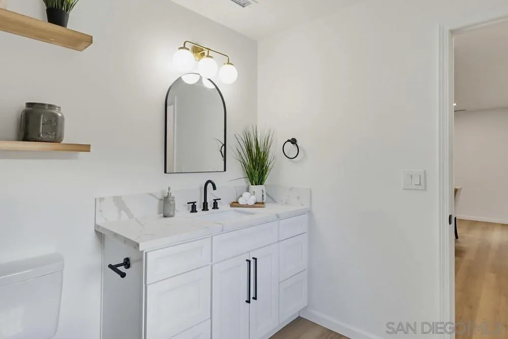 15751 Lyons Valley Road Jamul, CA 91935 - Photo 31 of 59 a bathroom with a sink and a mirror