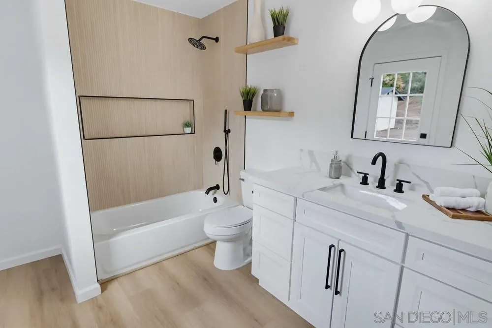 15751 Lyons Valley Road Jamul, CA 91935 - Photo 32 of 59 a bathroom with a sink toilet and shower