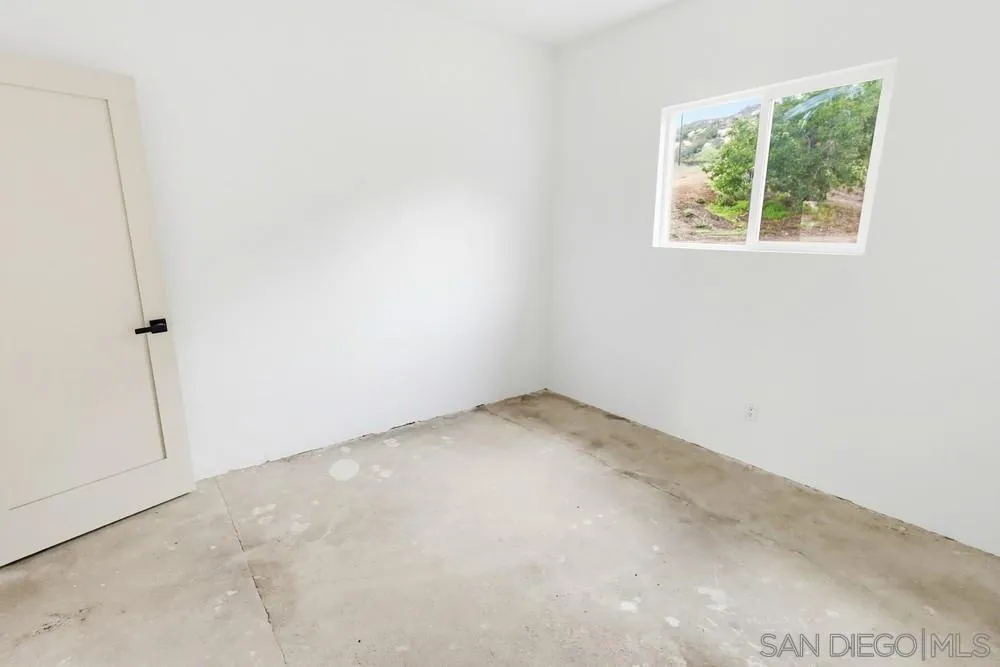 15751 Lyons Valley Road Jamul, CA 91935 - Photo 51 of 59 an empty room with a window