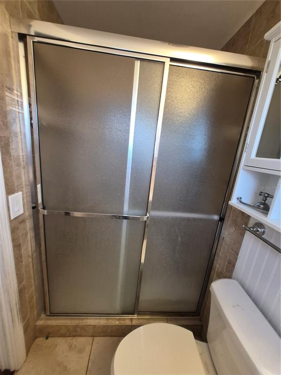 4004 Southwest 22nd Street Ocala, FL 34474 - Photo 8 of 9 a bathroom with a shower and toilet