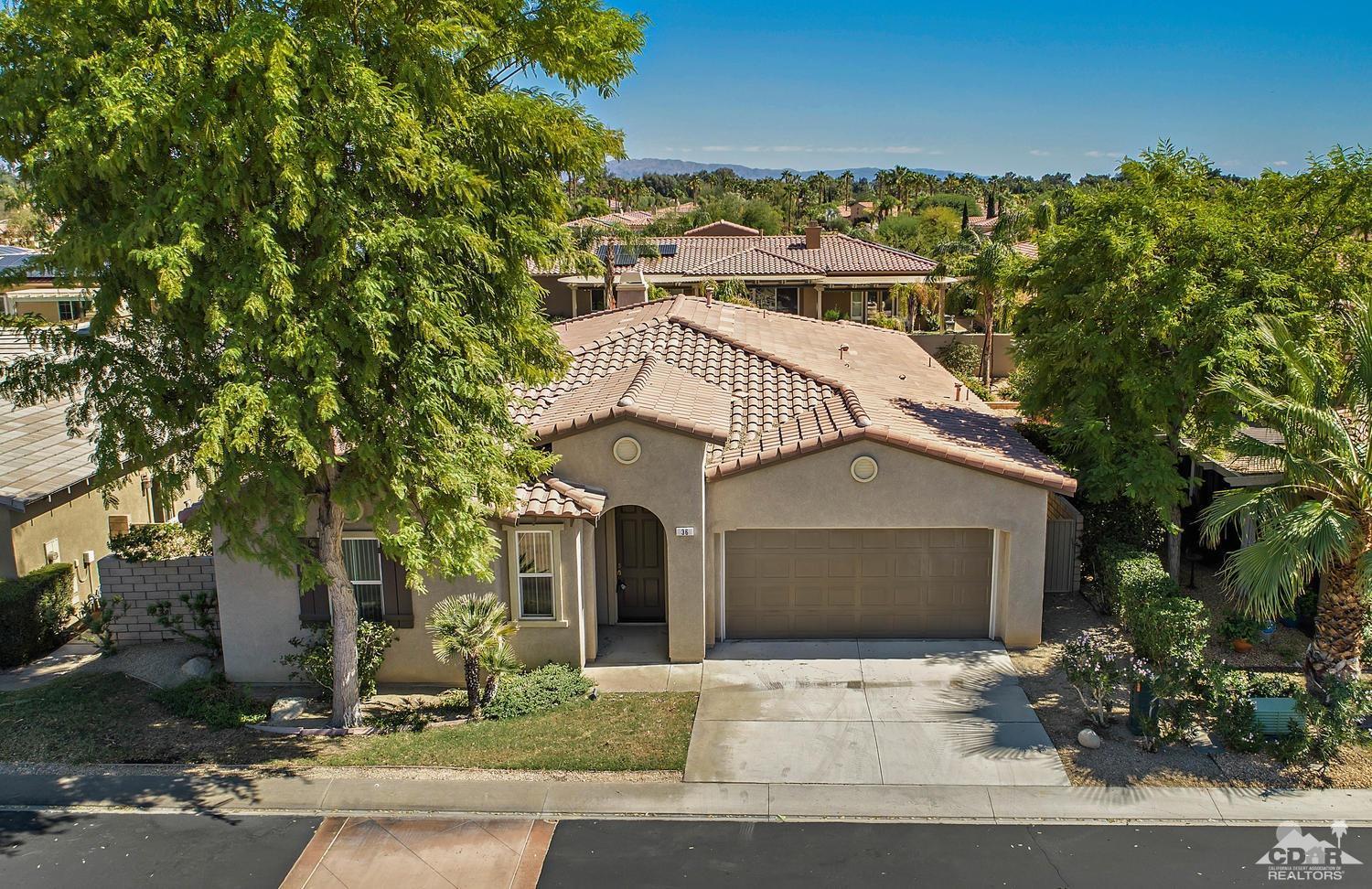 36 Shoreline Drive Rancho Mirage, CA 92270 - Photo 2 of 38 a front view of a house with a garden