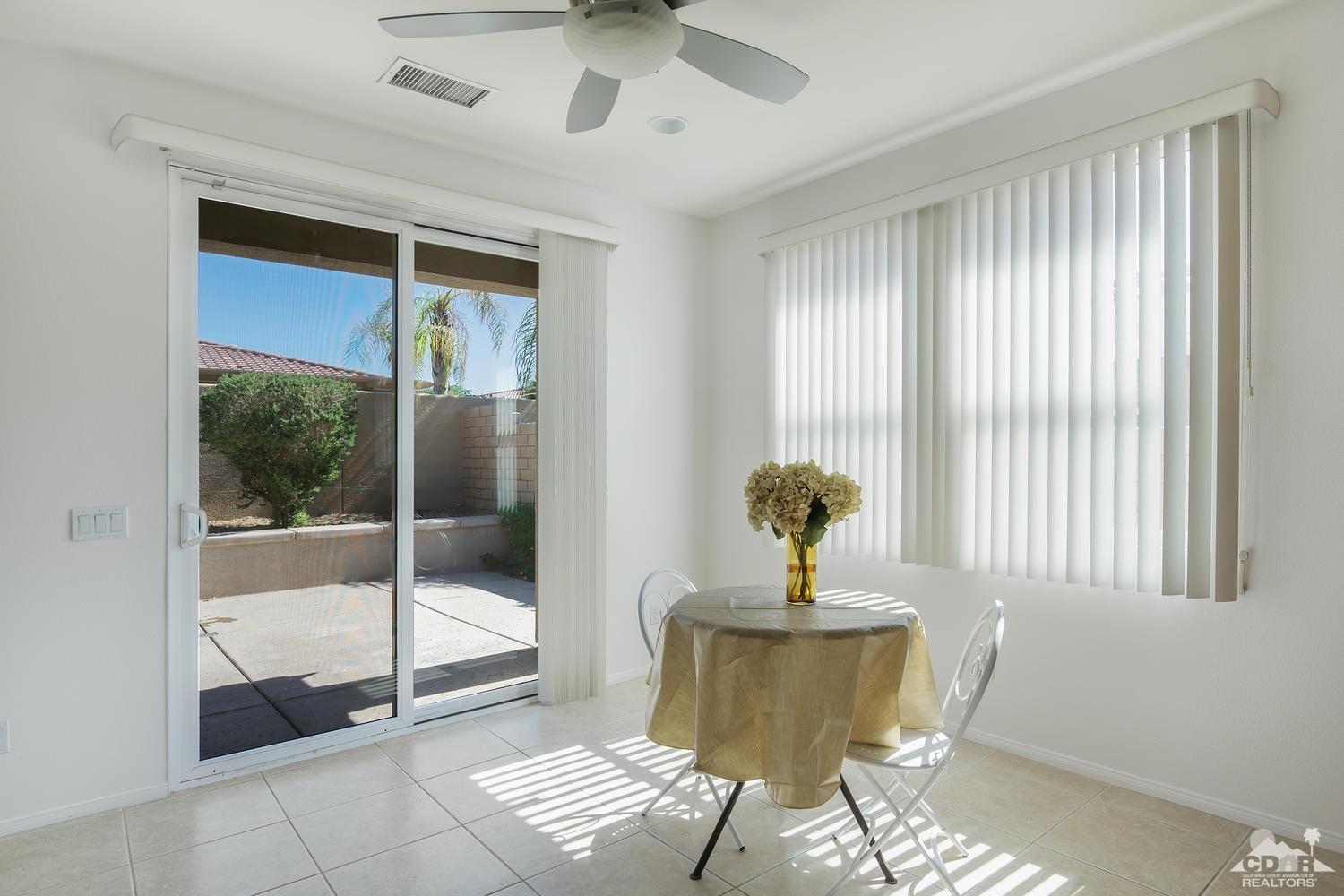 36 Shoreline Drive Rancho Mirage, CA 92270 - Photo 12 of 38 a living room with a window and a table