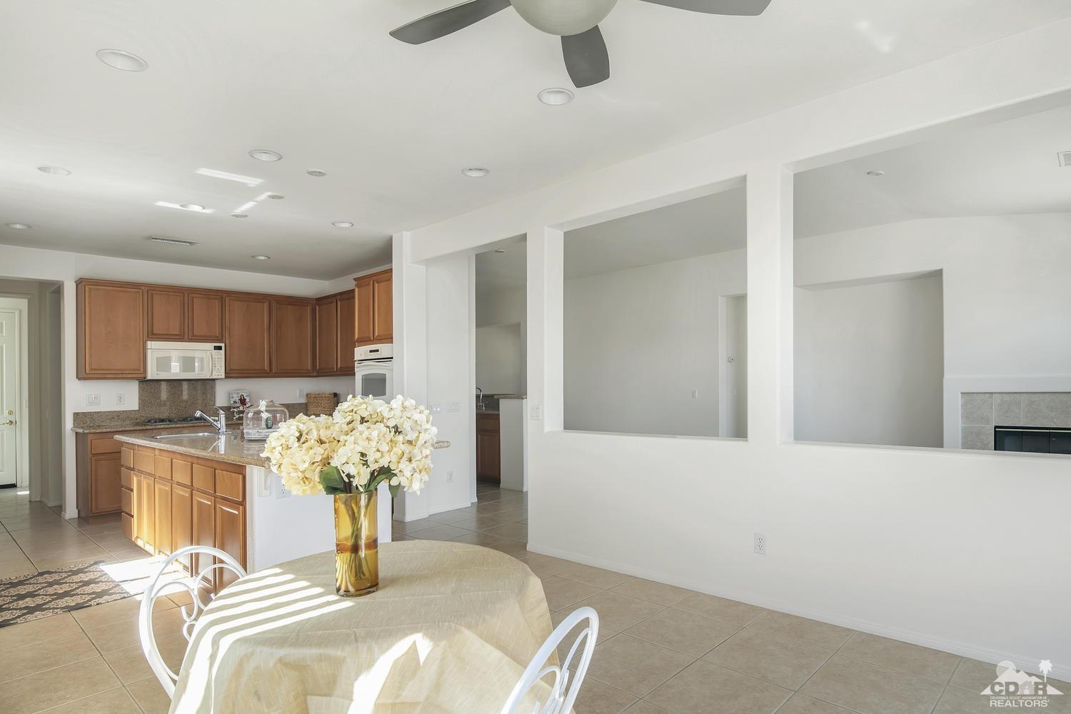 36 Shoreline Drive Rancho Mirage, CA 92270 - Photo 13 of 38 a bedroom with furniture and a chandelier