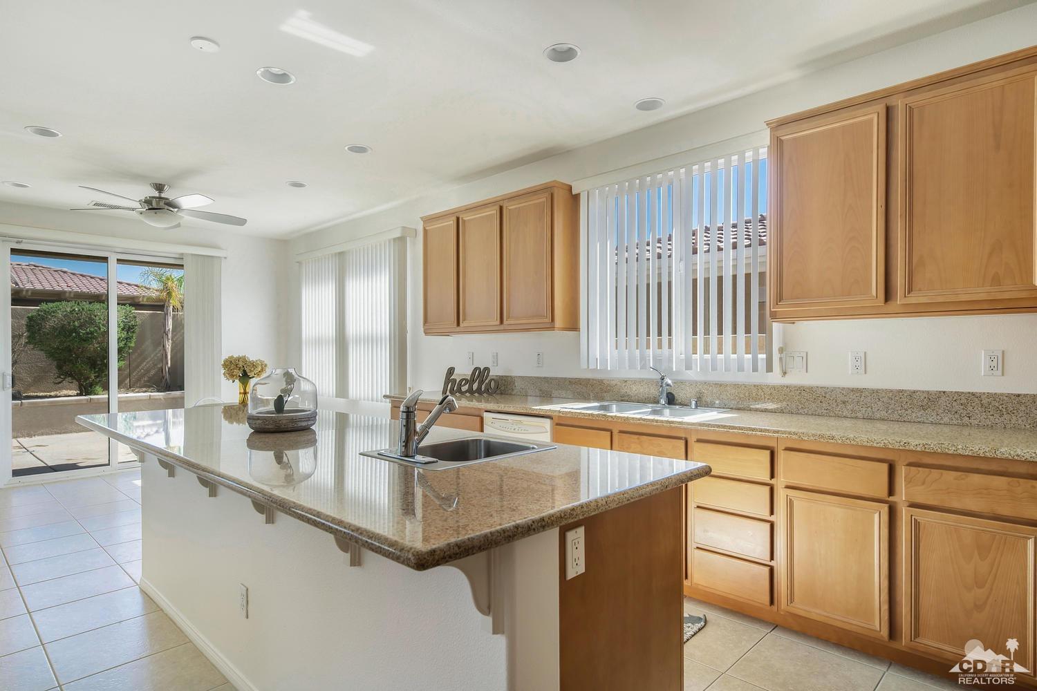 36 Shoreline Drive Rancho Mirage, CA 92270 - Photo 17 of 38 a kitchen with sink cabinets and window